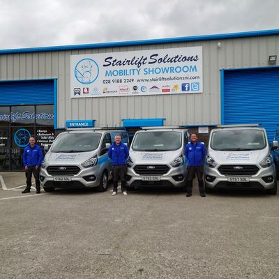Stairlift Solutions team and vans at the mobility showroom, Belfast