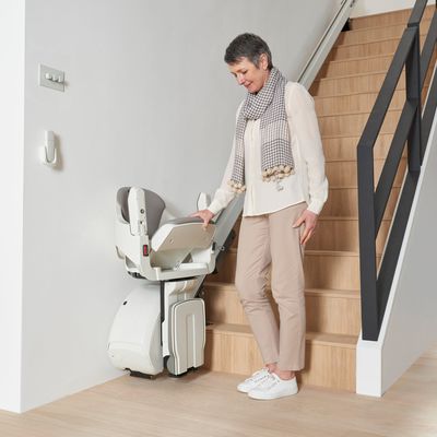 HomeGlide Extra stairlift at the foot of the stairs